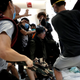 Pro-democracy activists hit a plainclothes police officer in a Hong Kong mall, July 14, 2019.